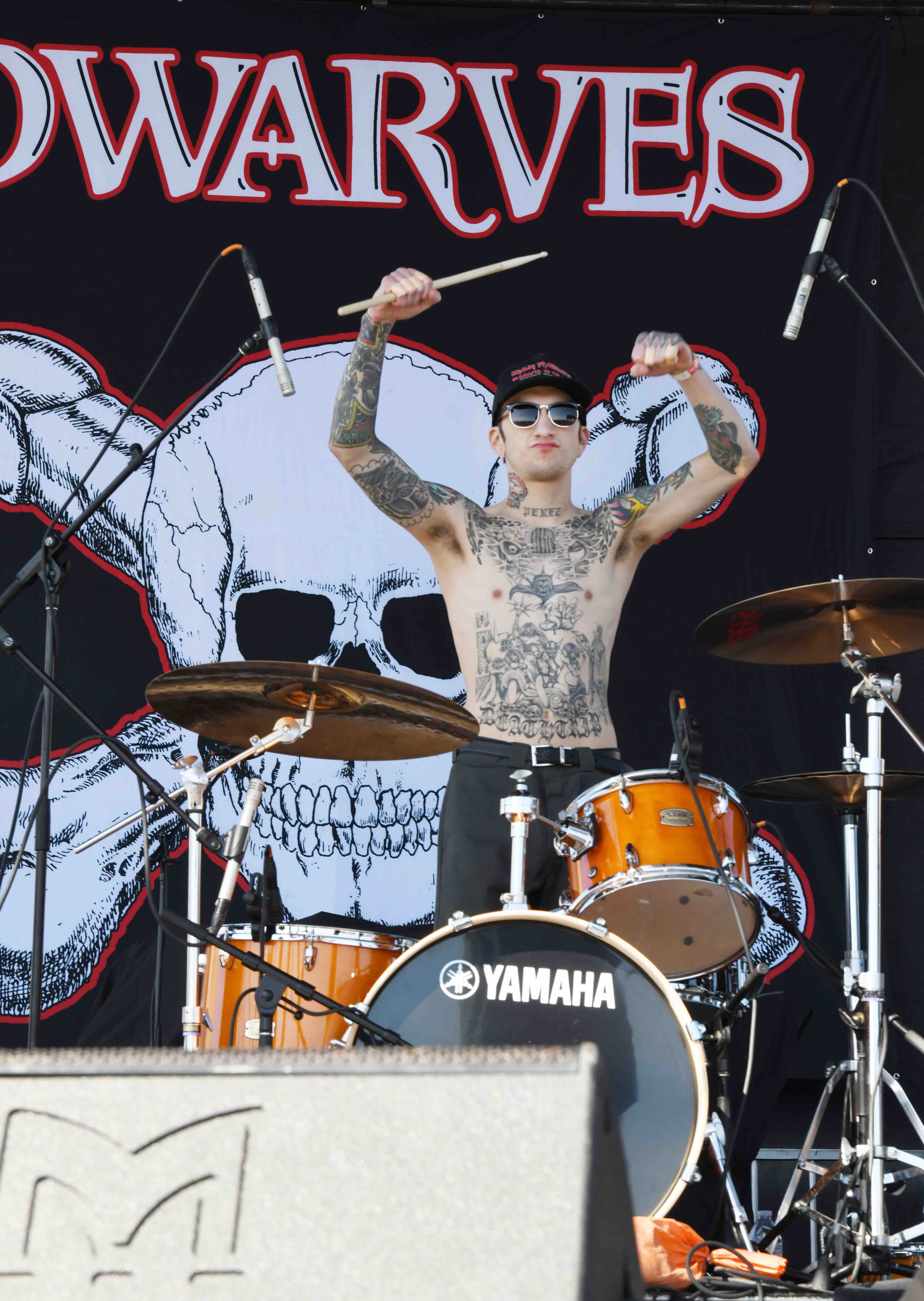 GabeArmsUpBackdropLive